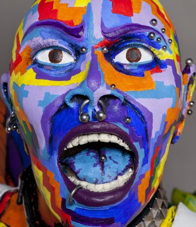 face shot of ceramic sculpture of punk chick with colorful surface decorati